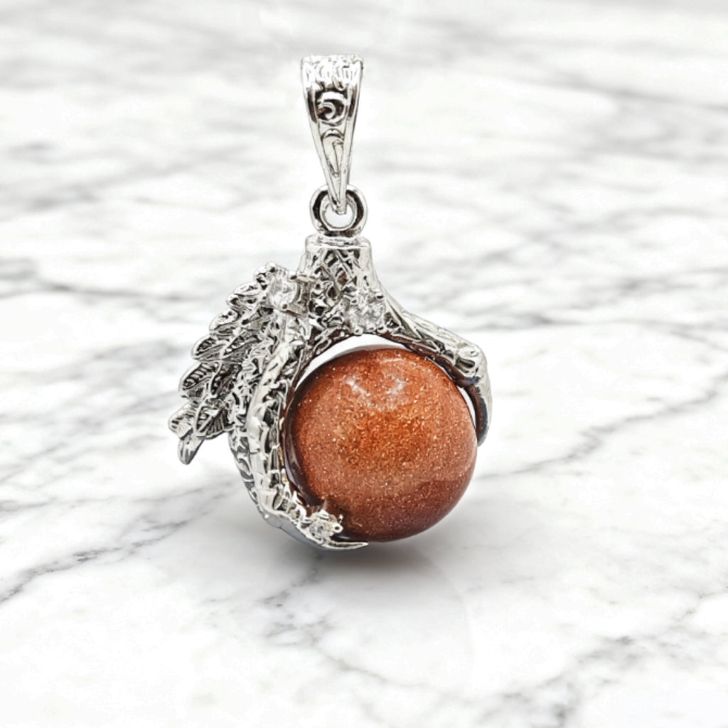 “Léger” Dragon Claw Orb Pendant — Goldstone Quartz