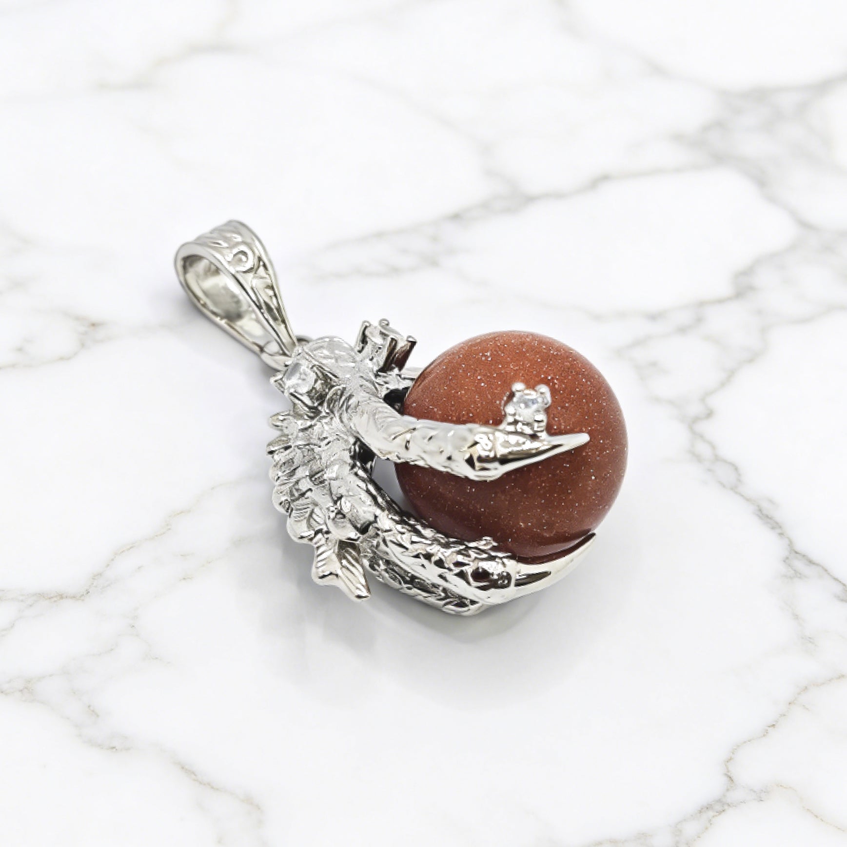 “Léger” Dragon Claw Orb Pendant — Goldstone Quartz