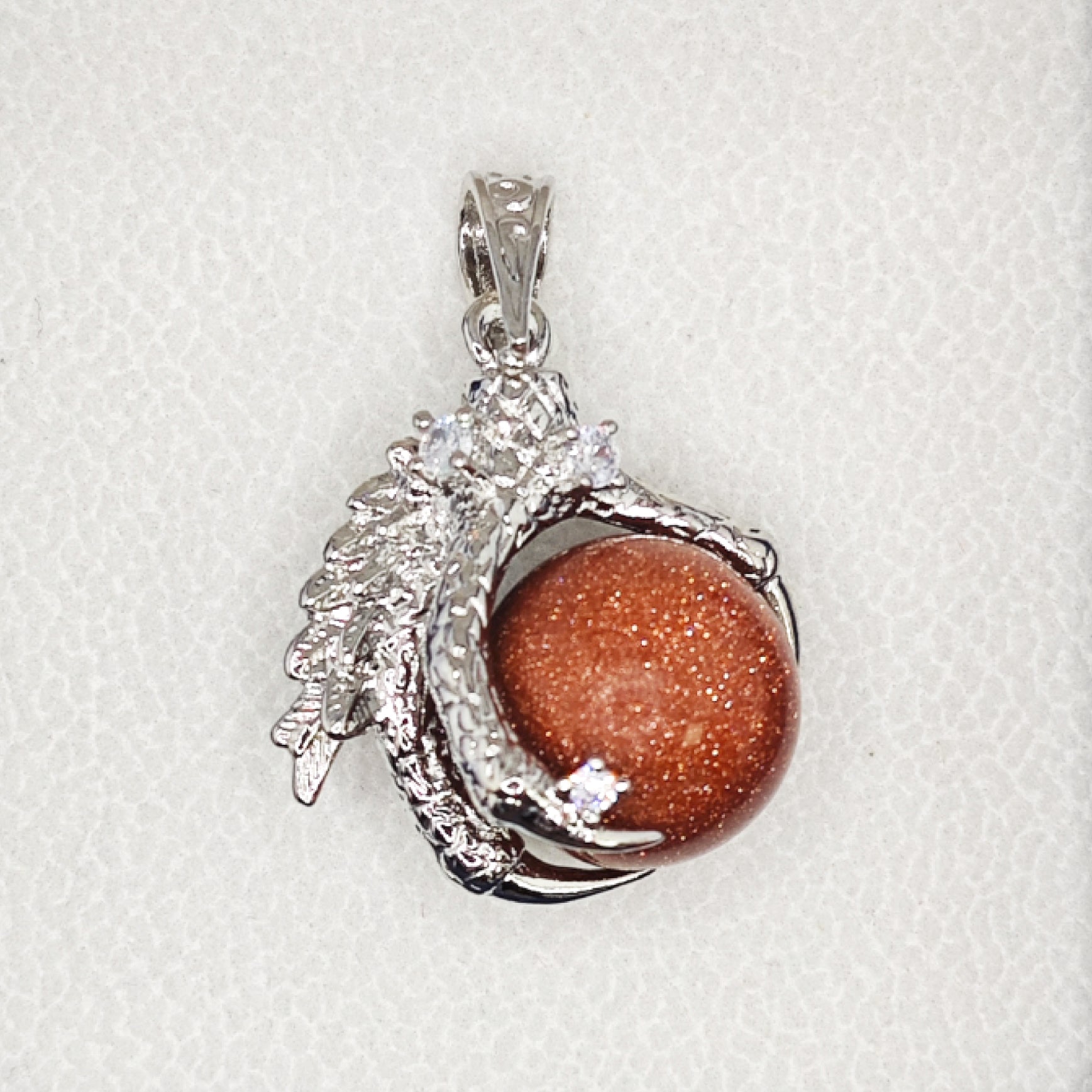 “Léger” Dragon Claw Orb Pendant — Goldstone Quartz