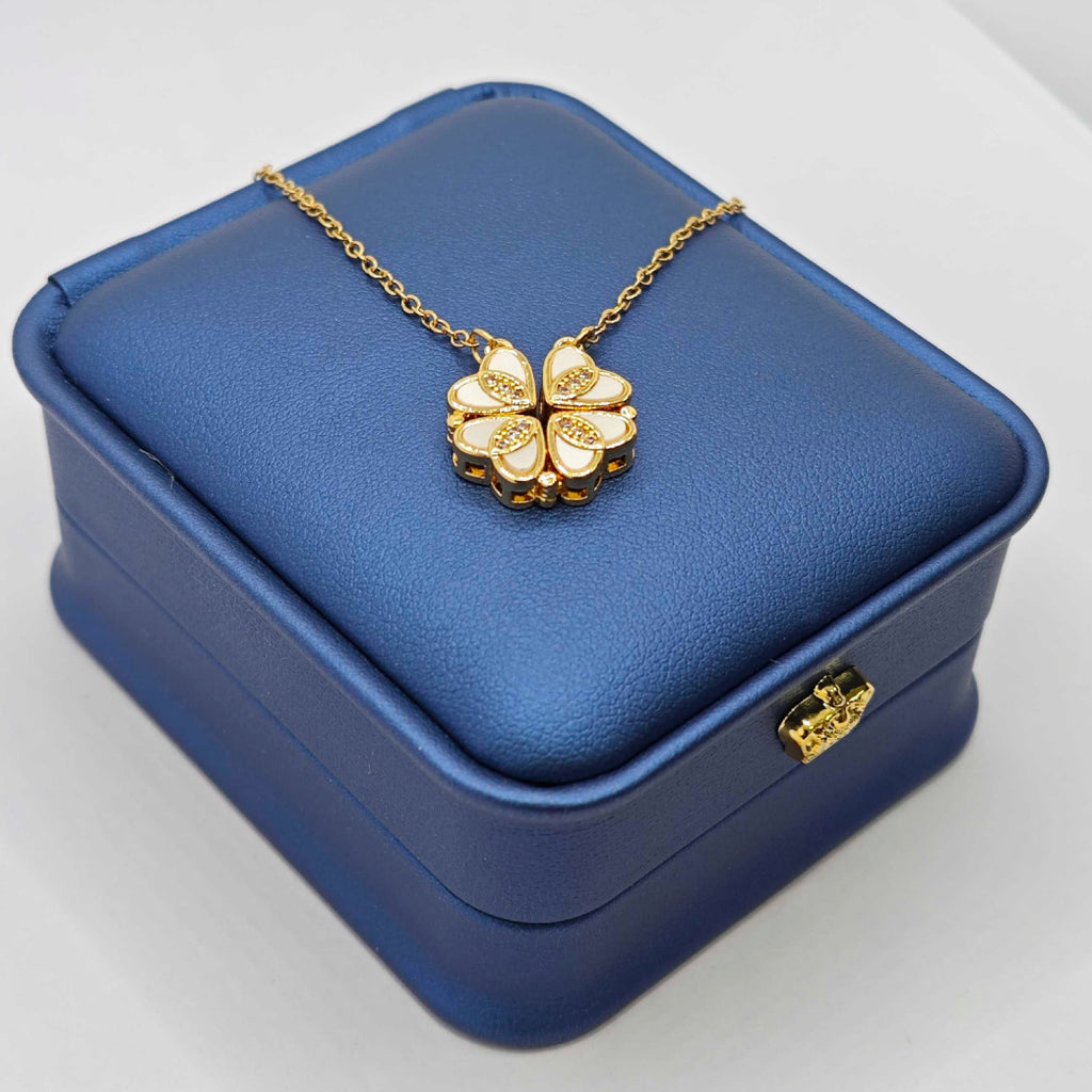 “Étreinte” Clover Pendant Necklace — 18K‑Plated Chain, Cross‑Divided White Inlay