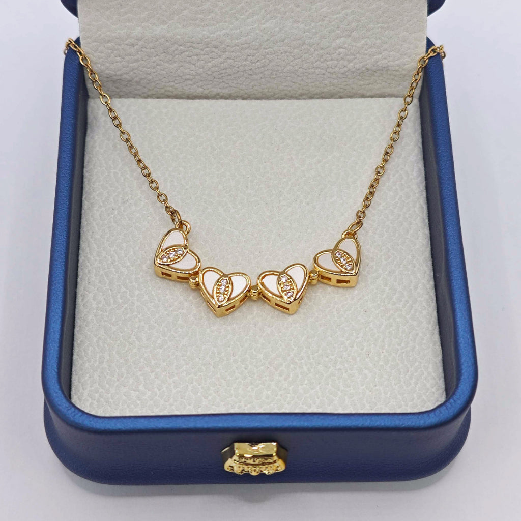 “Étreinte” Clover Pendant Necklace — 18K‑Plated Chain, Cross‑Divided White Inlay