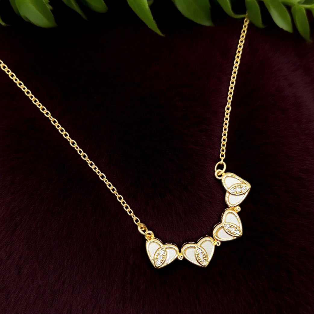 “Étreinte” Clover Pendant Necklace — 18K‑Plated Chain, Cross‑Divided White Inlay
