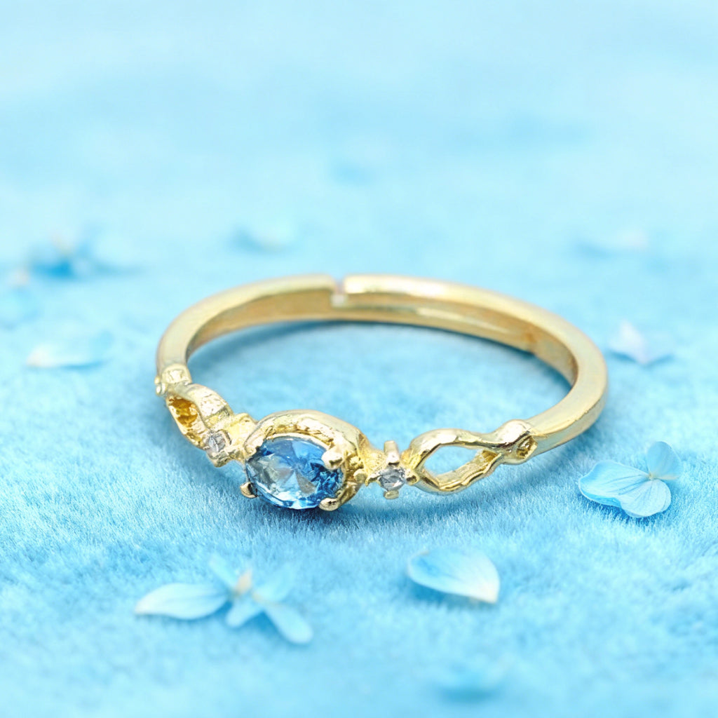 Bague réglable « Toujours » — Plaqué or 14 carats, fausse apatite bleu Paraíba et oxydes de zirconium clairs L’Ardeur