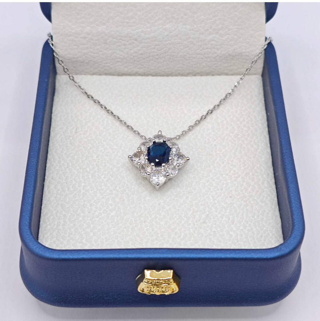 “Étreinte” Royal Halo Pendant Necklace — Platinum‑Tone, Tanzanite‑Blue L’Ardeur Crystal