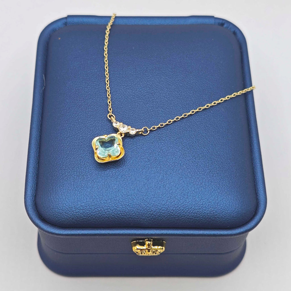“Étreinte” French Cross Blue Topaz-Style Pendant Necklace — 14K Gold‑Plated