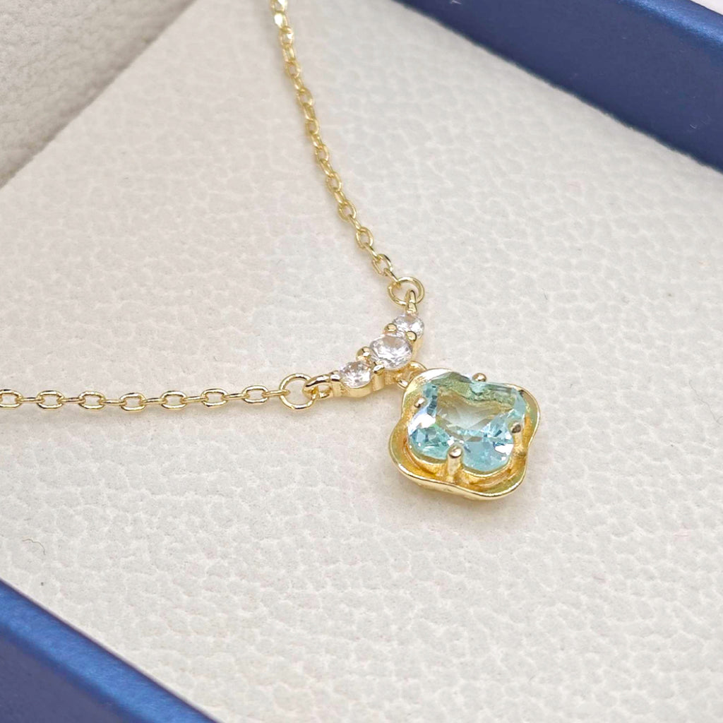 “Étreinte” French Cross Blue Topaz-Style Pendant Necklace — 14K Gold‑Plated