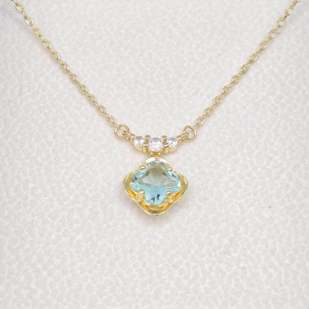 “Étreinte” French Cross Blue Topaz-Style Pendant Necklace — 14K Gold‑Plated