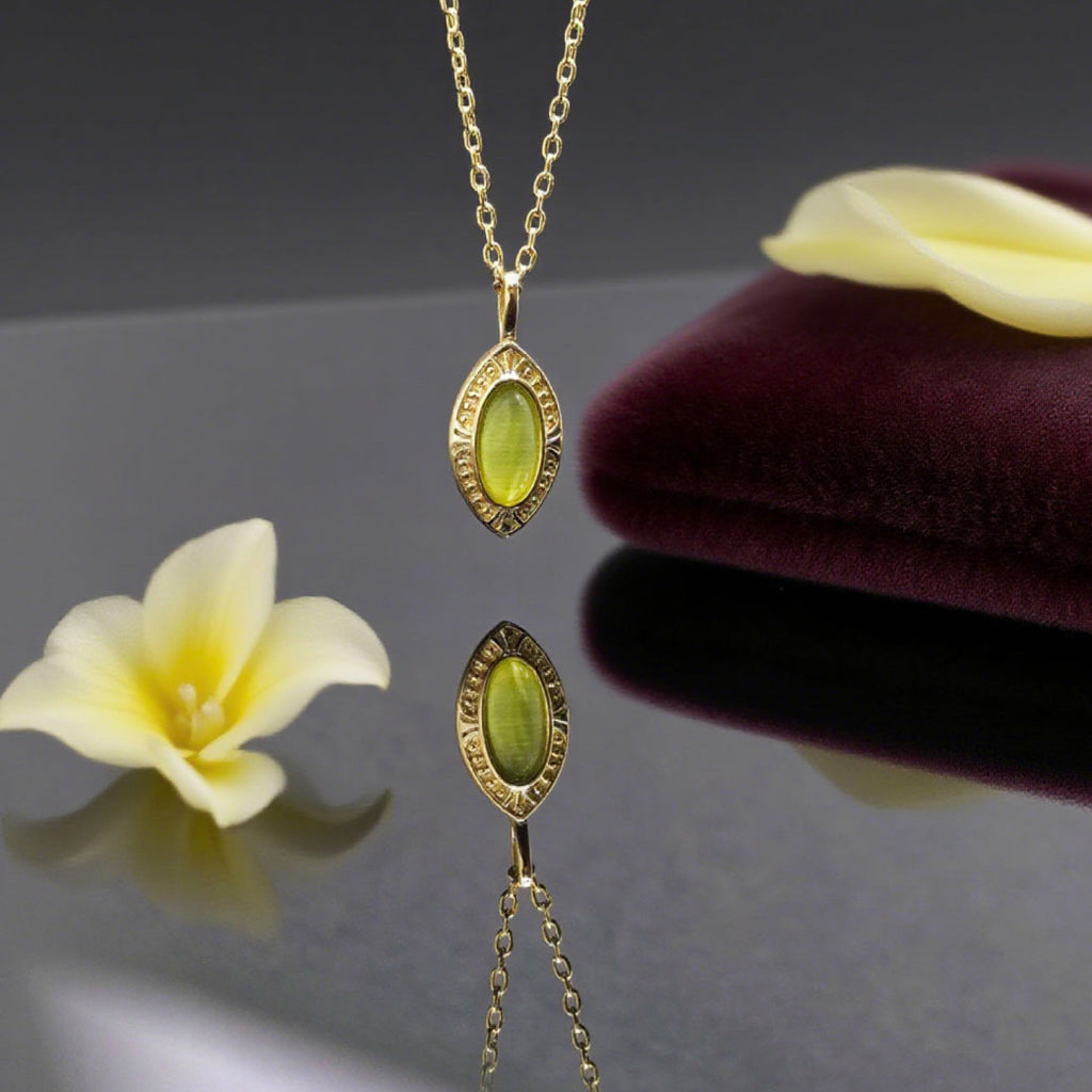 “Étreinte” Oval Green Crystal Pendant Necklace — 14K Gold‑Plated