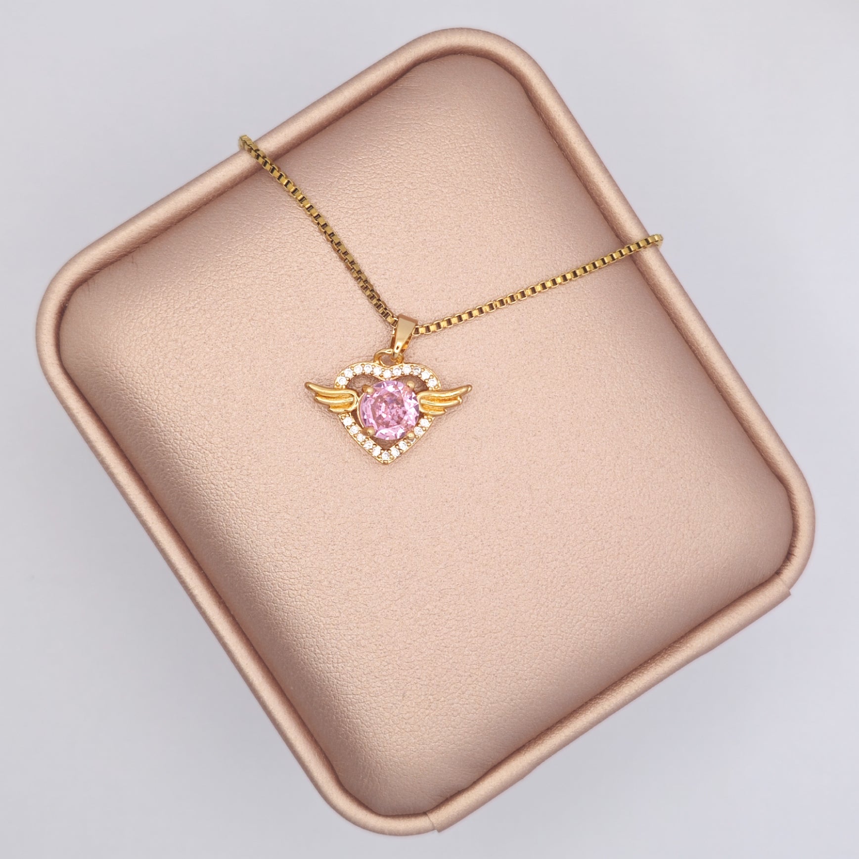 “Étreinte” Angel Heart Pendant Necklace — 18K Gold‑Plated, Pink Diamond‑Style