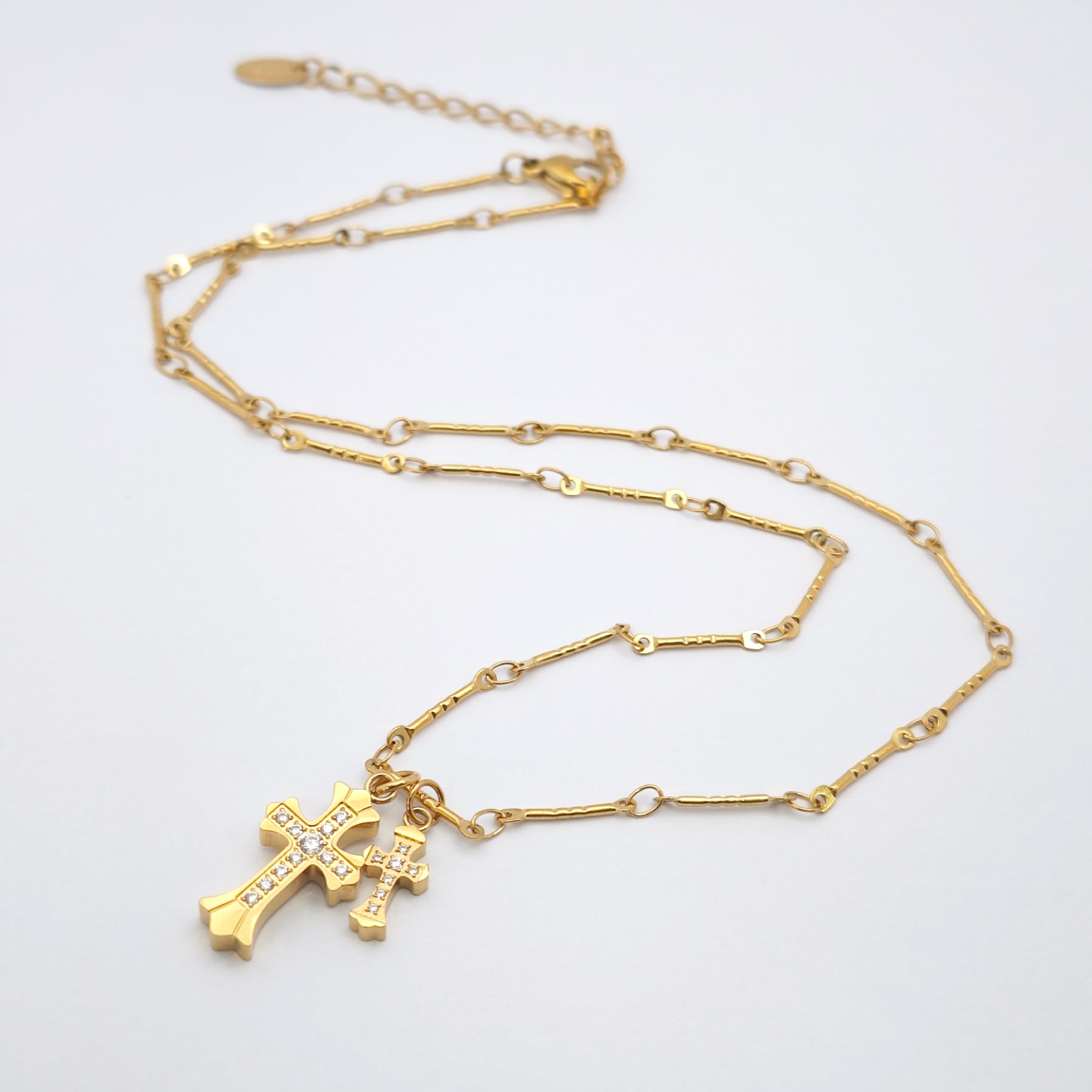 “Étreinte” Duo Cross Charm Necklace — 18K Gold‑Plated, Diamond‑Style