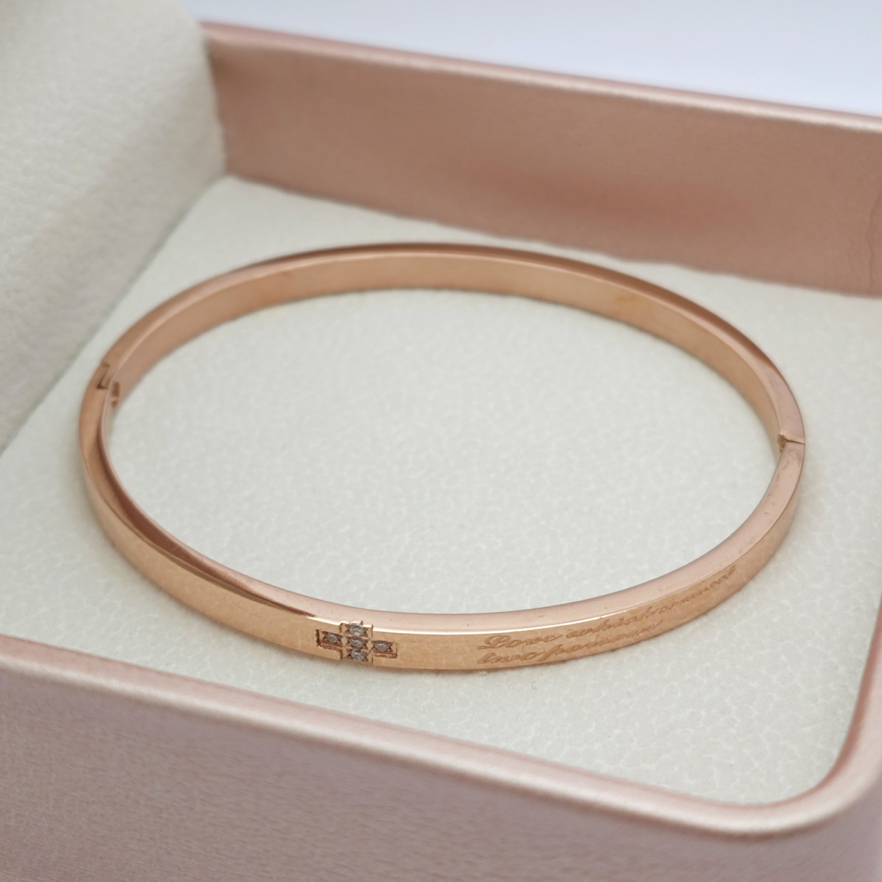 “Lien” Cross-Clasp Bangle — 18K Gold‑Plated, High-grade CZ